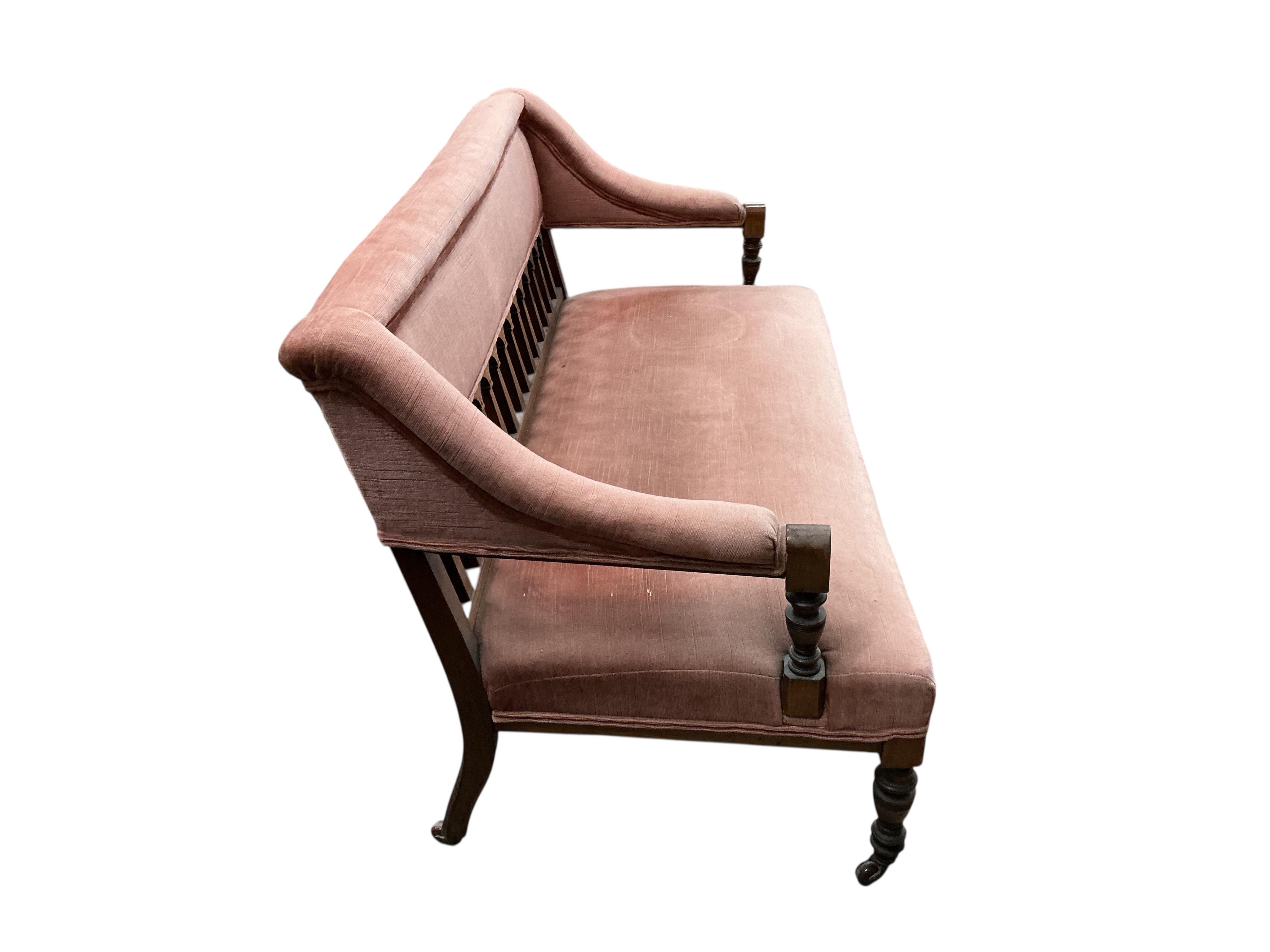 A late Victorian mahogany settee, width 128cm, depth 60cm, height 78cm.